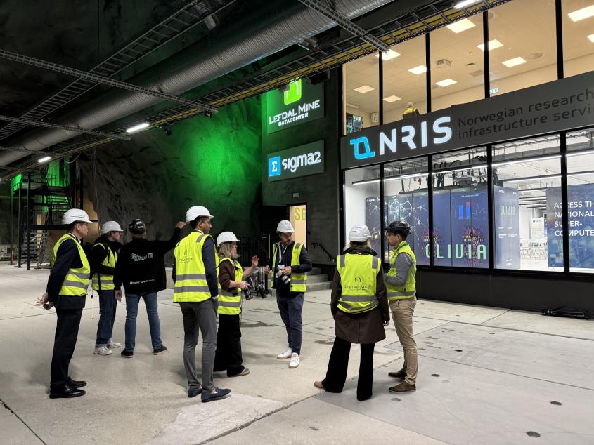 People standing outside the Sigma2 data hall. 