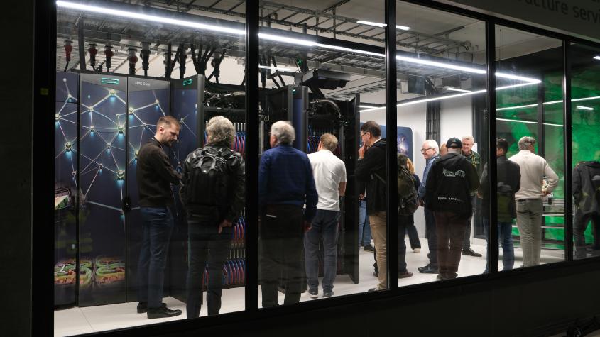 People looking at supercomputer Olivia.