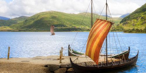 A Viking ship in a quay in beautiful nature.