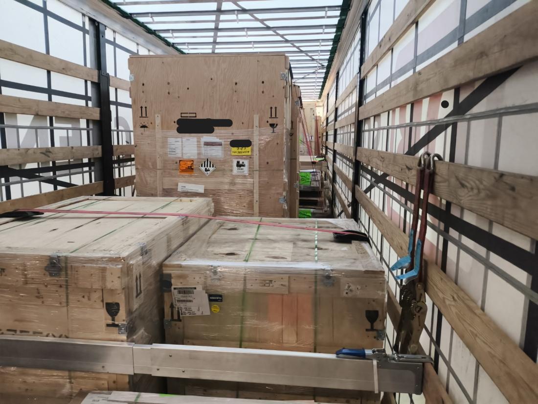 Cardboard boxes inside a trailer. 
