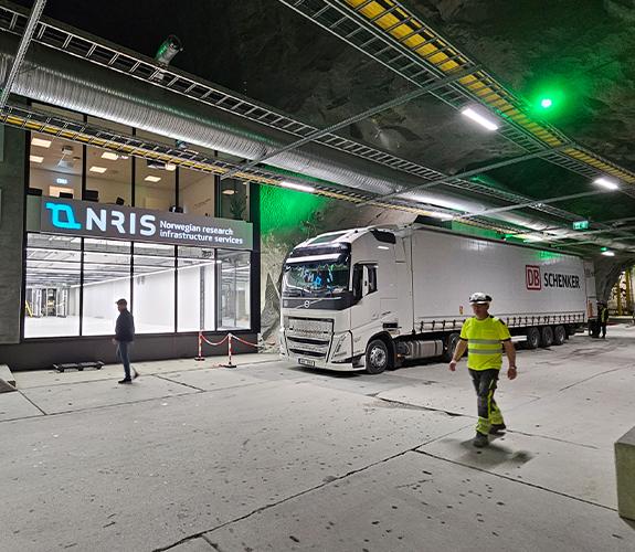 A truck outside a data hall inside an old mine. 