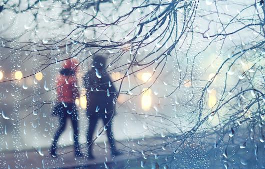 To people walking in the rain.