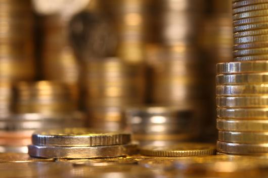 Close up of piles of coins. 