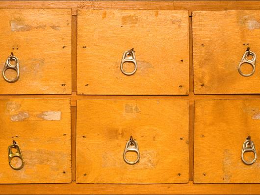 Close of up a chest of drawers.