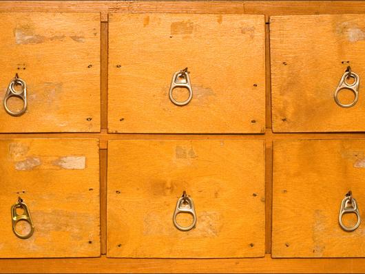 Close of up a chest of drawers. 