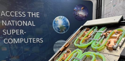 Close up of a GPU in front of text stating "Access the National Supercomputers"