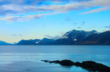 Arctic landscape of sea and mountains. 
