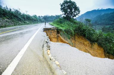 A road where parts of it has disappeared in a landslide.