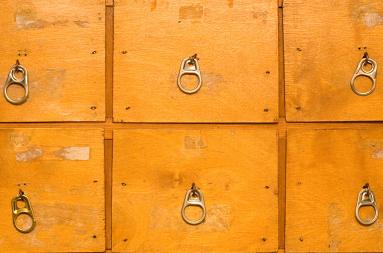 Close of up a chest of drawers. 