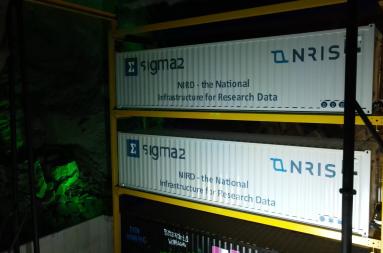 Two large containers in a yellow rack. 